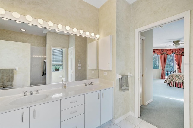 bathroom with double sink, tile floors, large vanity, and ceiling fan