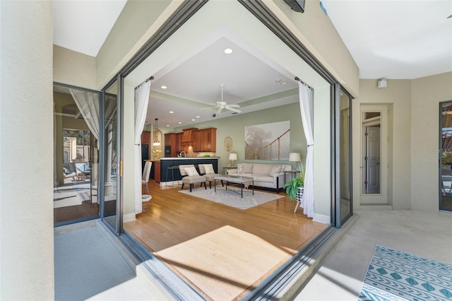 interior space featuring ceiling fan and light hardwood / wood-style flooring