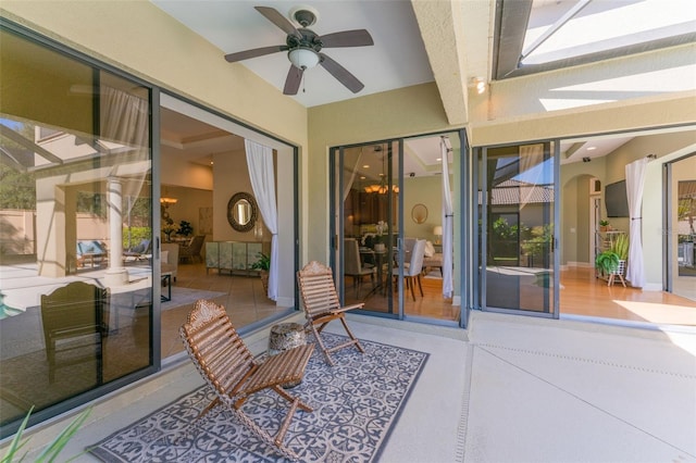 view of patio featuring ceiling fan