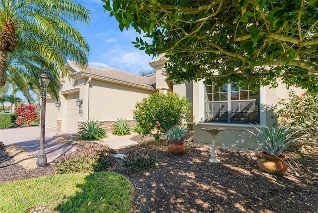 view of property exterior featuring a garage