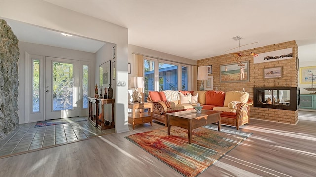 living room with tile flooring and a fireplace