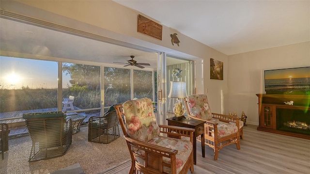 sunroom featuring ceiling fan