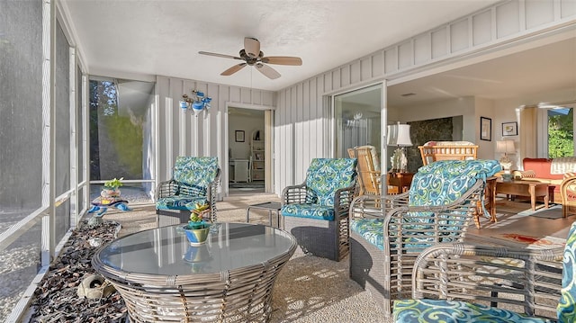 sunroom with ceiling fan