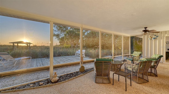 sunroom / solarium with ceiling fan