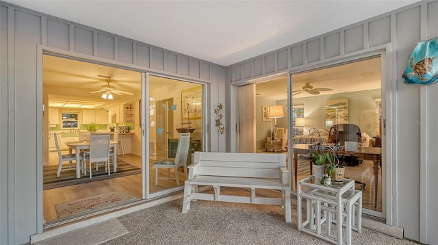 sunroom featuring ceiling fan