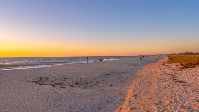 property view of water featuring a beach view