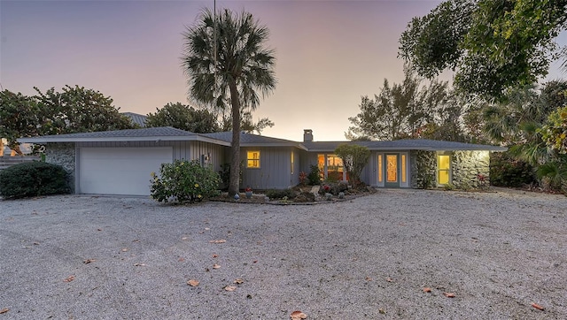 ranch-style house featuring a garage