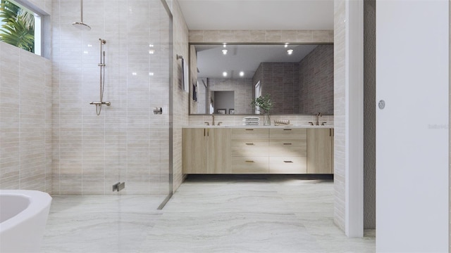 bathroom with tile walls, independent shower and bath, and vanity