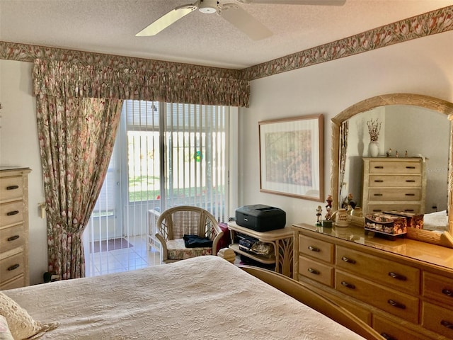 bedroom with access to outside, a textured ceiling, and ceiling fan