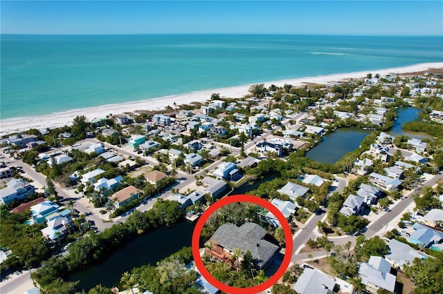 aerial view featuring a water view and a view of the beach