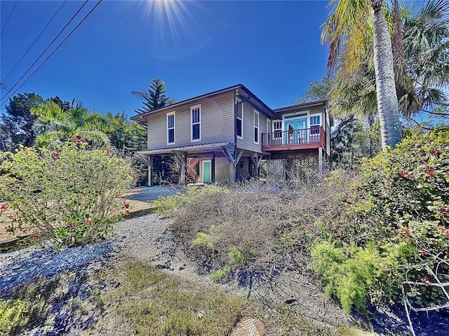 back of property featuring a deck