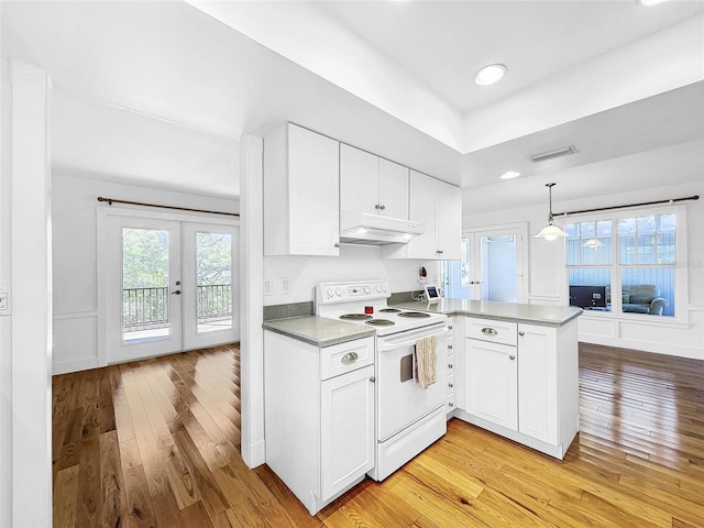 kitchen with premium range hood, white electric range oven, kitchen peninsula, white cabinetry, and light wood-type flooring