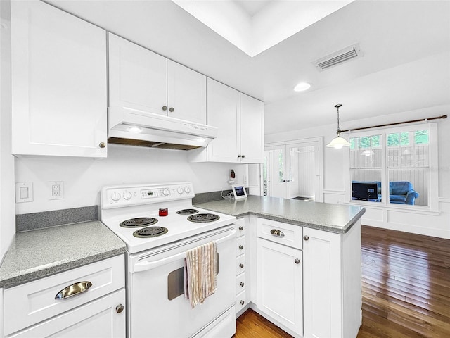 kitchen with white range with electric stovetop, hanging light fixtures, dark wood-type flooring, and kitchen peninsula