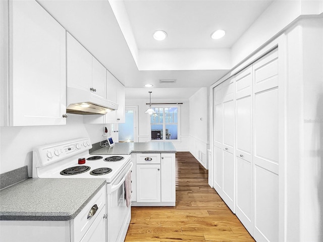 kitchen featuring kitchen peninsula, hanging light fixtures, white cabinets, white range with electric cooktop, and light hardwood / wood-style floors