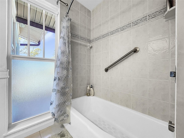 bathroom with shower / tub combo and tile floors