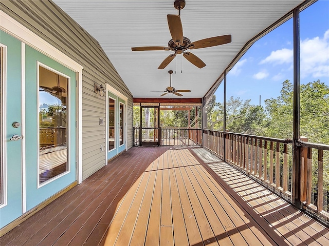 wooden deck featuring ceiling fan