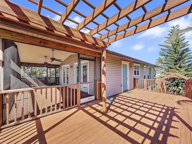 deck with ceiling fan and a pergola