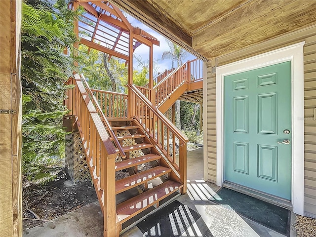 property entrance featuring a wooden deck