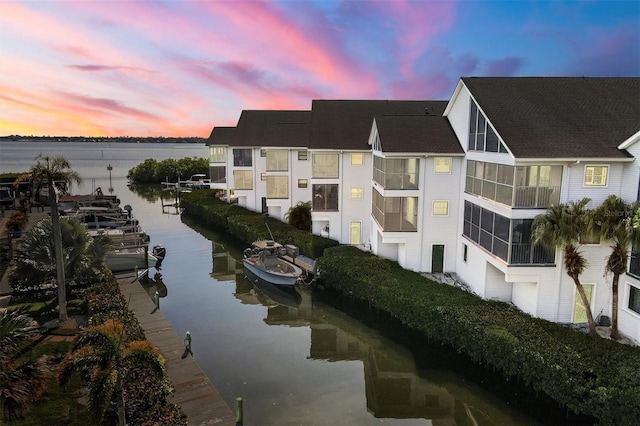 outdoor building at dusk featuring a water view