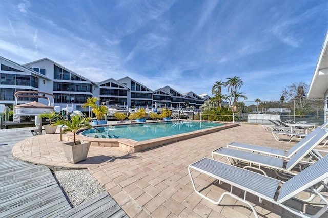 view of swimming pool with a patio