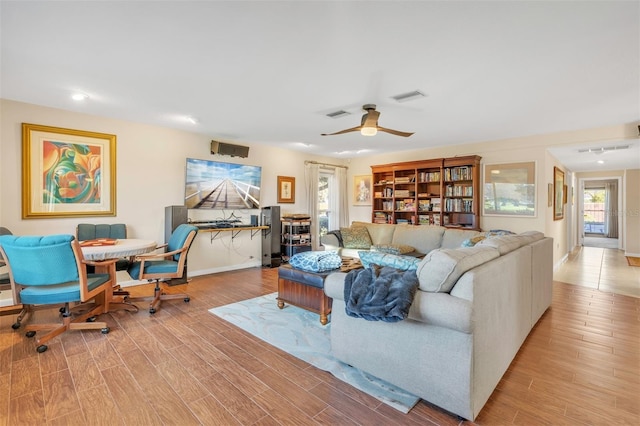 living room with ceiling fan