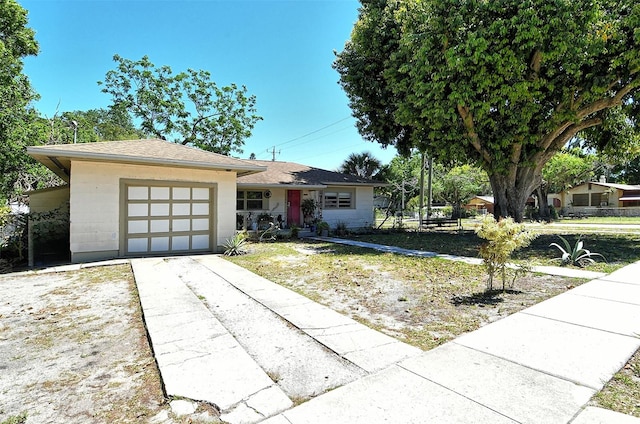 view of front of property with a garage