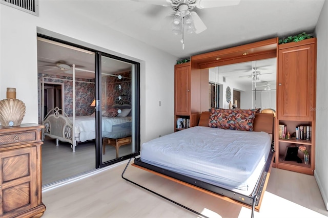 bedroom with ceiling fan and light hardwood / wood-style flooring