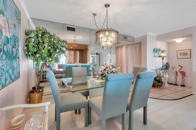 dining area featuring an inviting chandelier