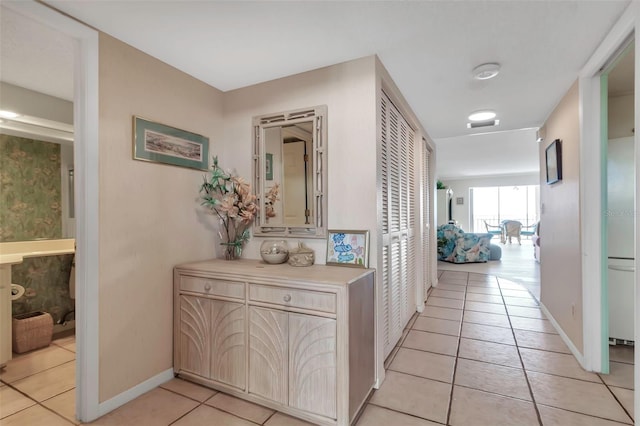 hallway with light tile floors