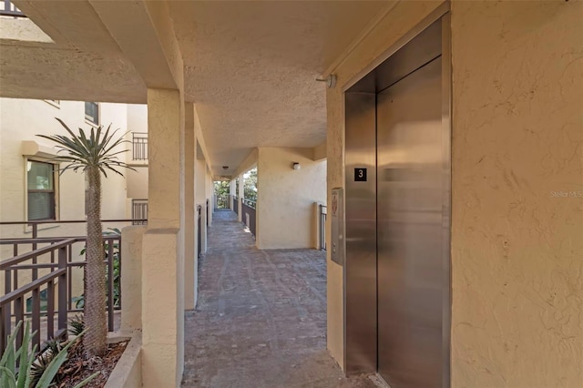 hallway featuring elevator