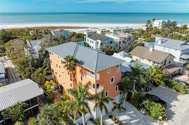 bird's eye view featuring a water view and a view of the beach