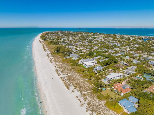 aerial view featuring a water view and a view of the beach