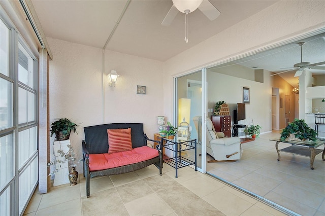 sunroom featuring ceiling fan