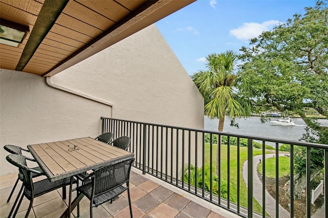 balcony featuring a water view