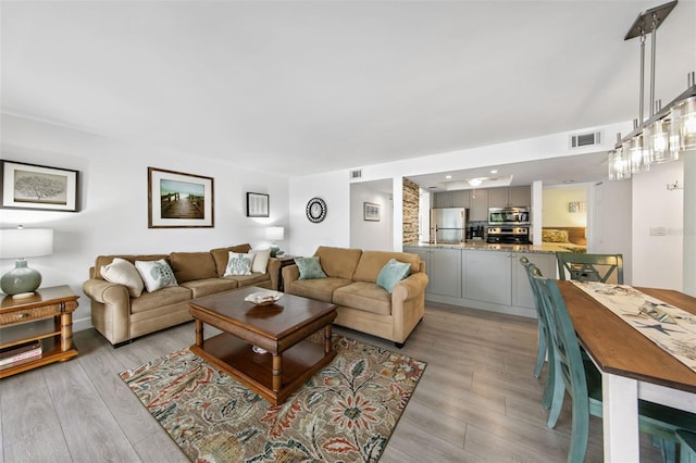 living room featuring light wood-type flooring