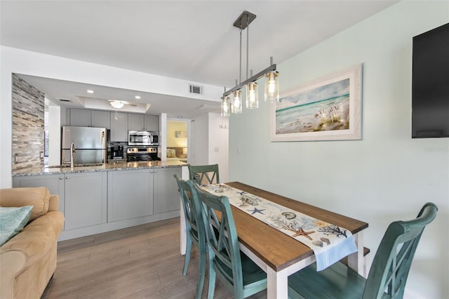 dining room featuring light wood-type flooring