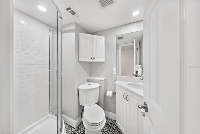 bathroom with toilet, vanity with extensive cabinet space, and tile flooring