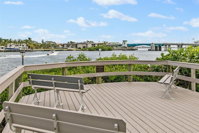 wooden deck featuring a water view