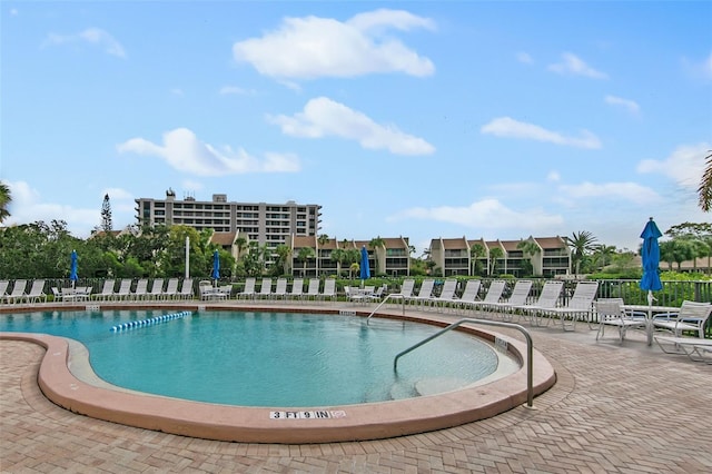 view of swimming pool with a patio