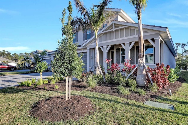 view of front of house with a front yard and driveway