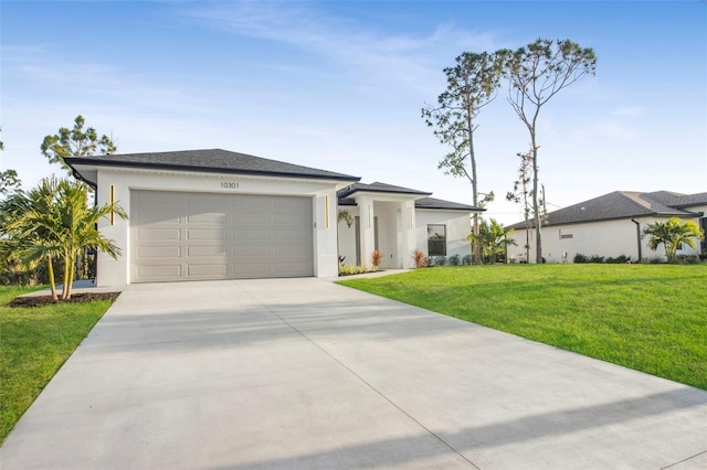 view of front facade featuring a front yard and a garage