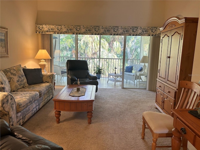 living room with a healthy amount of sunlight and light colored carpet