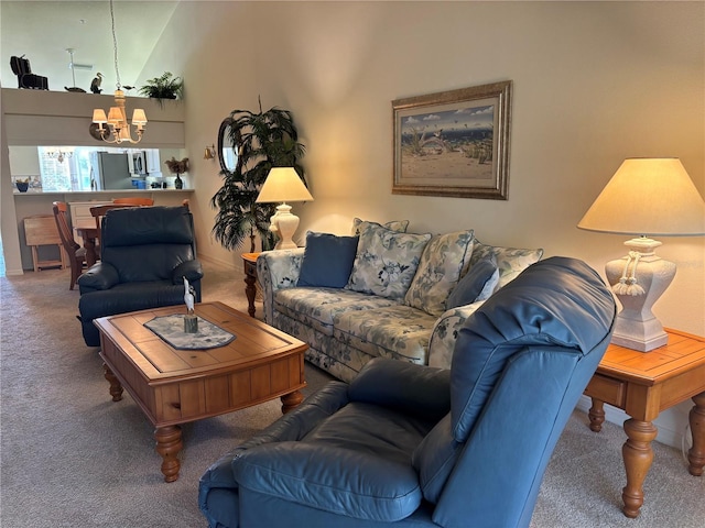 living room featuring carpet, high vaulted ceiling, and an inviting chandelier