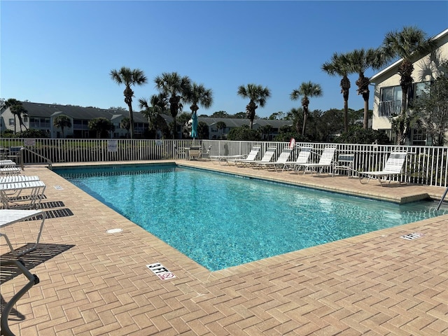 view of swimming pool with a patio area