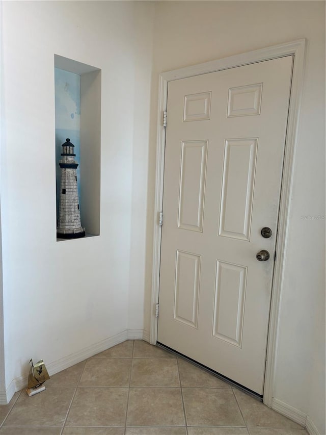 hallway featuring light tile flooring