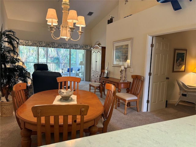 carpeted dining space featuring vaulted ceiling and a notable chandelier