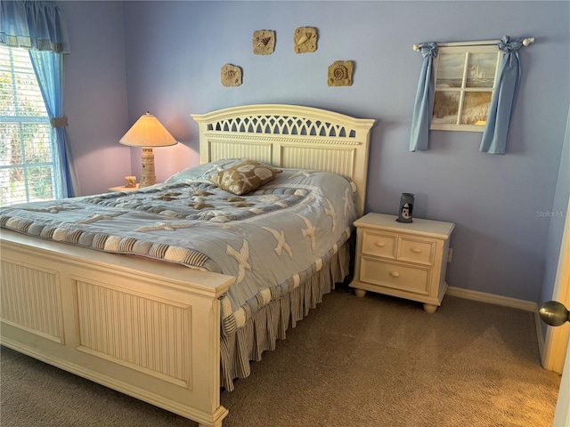 bedroom featuring dark colored carpet