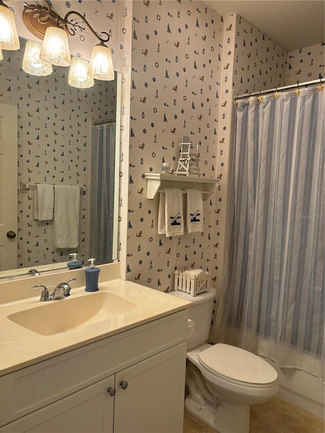 full bathroom featuring toilet, a textured ceiling, vanity, tile flooring, and shower / tub combo with curtain