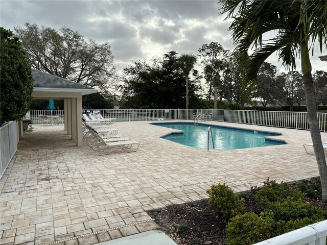 view of swimming pool featuring a patio