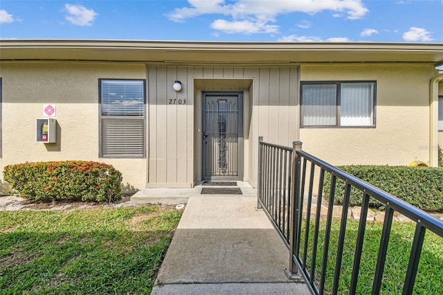 entrance to property with a balcony